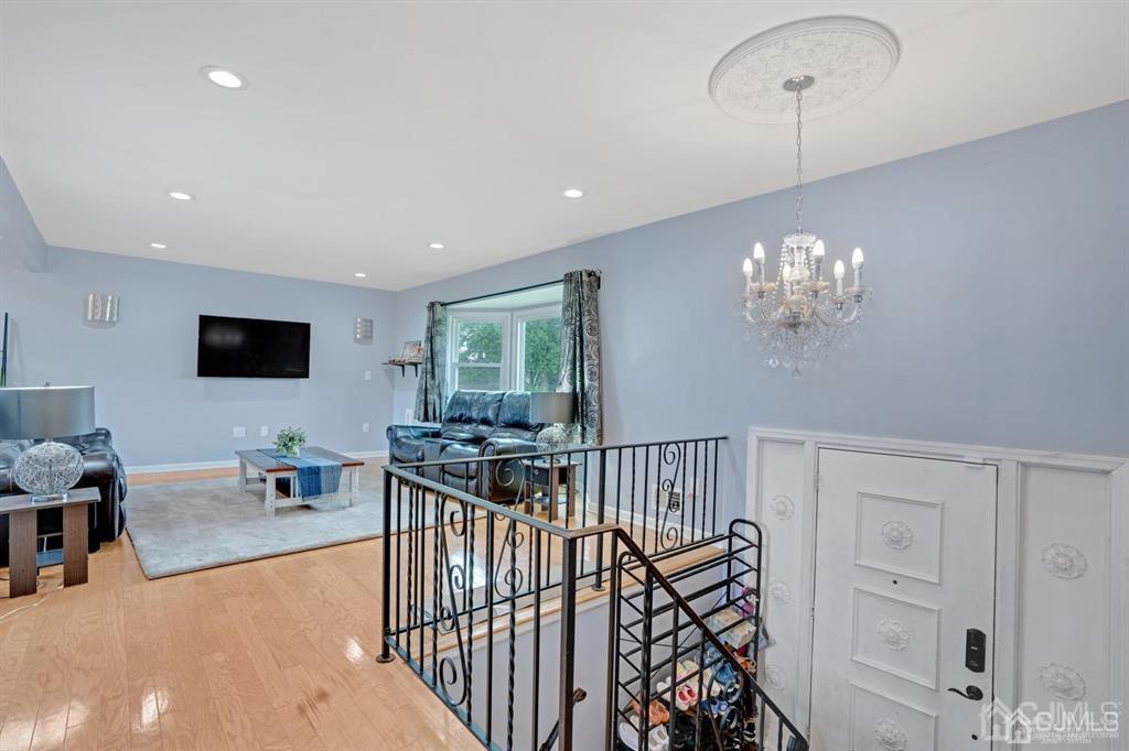 23 Vauxhall Road East Brunswick, NJ 08816 - Photo 2 of 28 a view of a livingroom with furniture chandelier