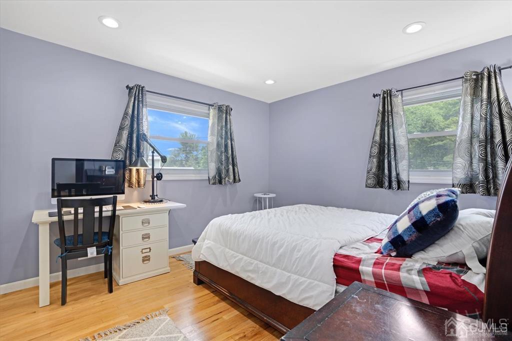 23 Vauxhall Road East Brunswick, NJ 08816 - Photo 21 of 28 a bedroom with a bed and furniture