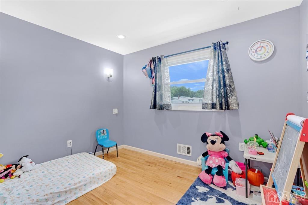 23 Vauxhall Road East Brunswick, NJ 08816 - Photo 22 of 28 a bed room with a bed and a window