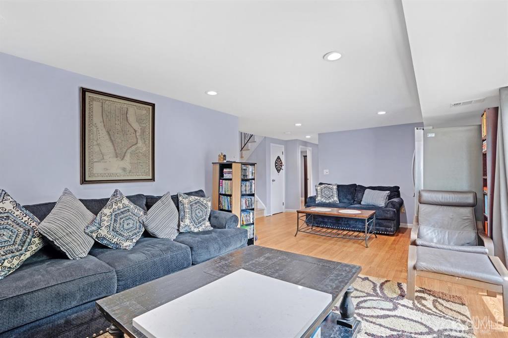 23 Vauxhall Road East Brunswick, NJ 08816 - Photo 23 of 28 a living room with furniture and a rug