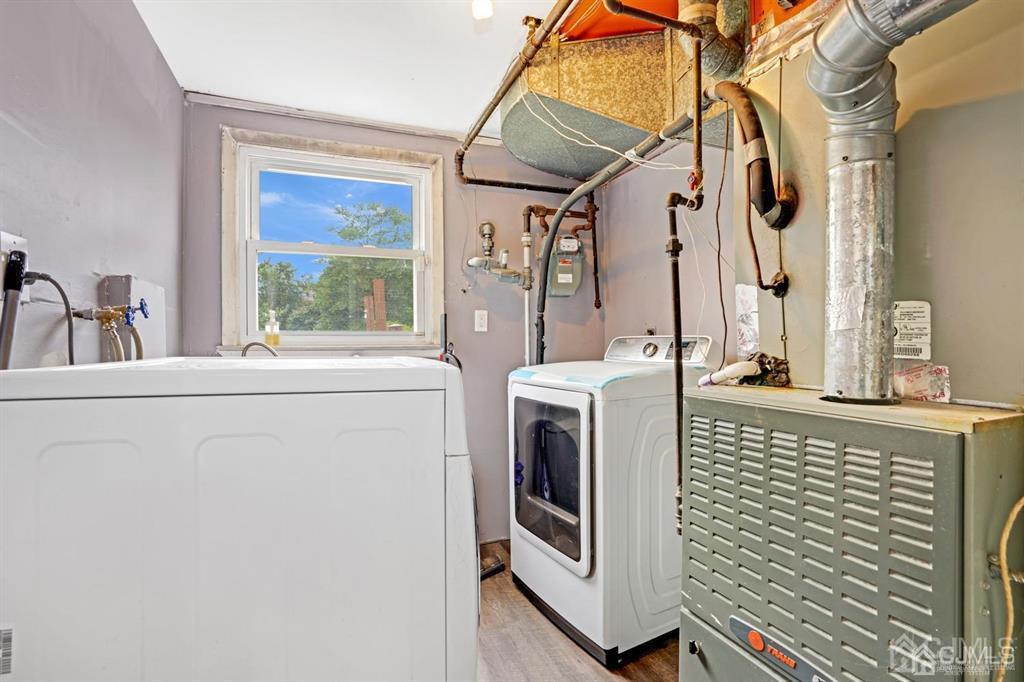 23 Vauxhall Road East Brunswick, NJ 08816 - Photo 25 of 28 a utility room with dryer and washer