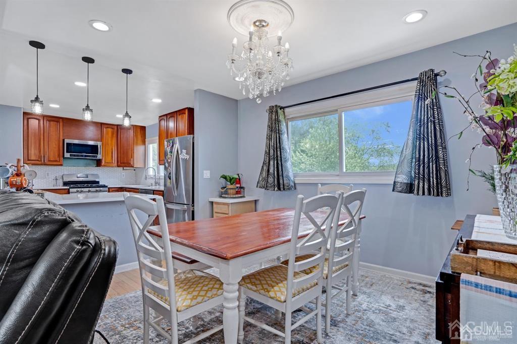 23 Vauxhall Road East Brunswick, NJ 08816 - Photo 3 of 28 a view of a dining room with furniture window and outside view