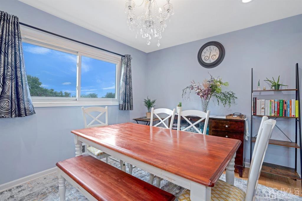 23 Vauxhall Road East Brunswick, NJ 08816 - Photo 5 of 28 a view of a dining room with furniture window and wooden floor
