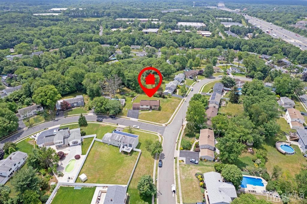 23 Vauxhall Road East Brunswick, NJ 08816 - Photo 8 of 28 an aerial view of house with yard swimming pool and outdoor seating