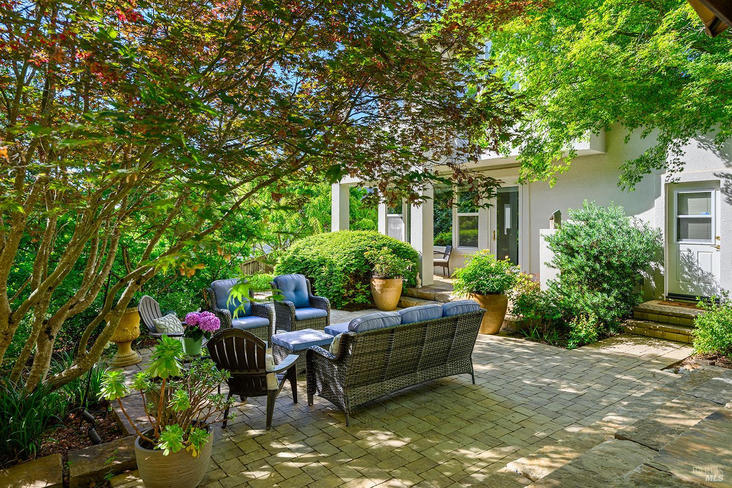 3696 Newbury Court Santa Rosa, CA 95404 - Photo 43 of 52 a patio with table and chairs and potted plants
