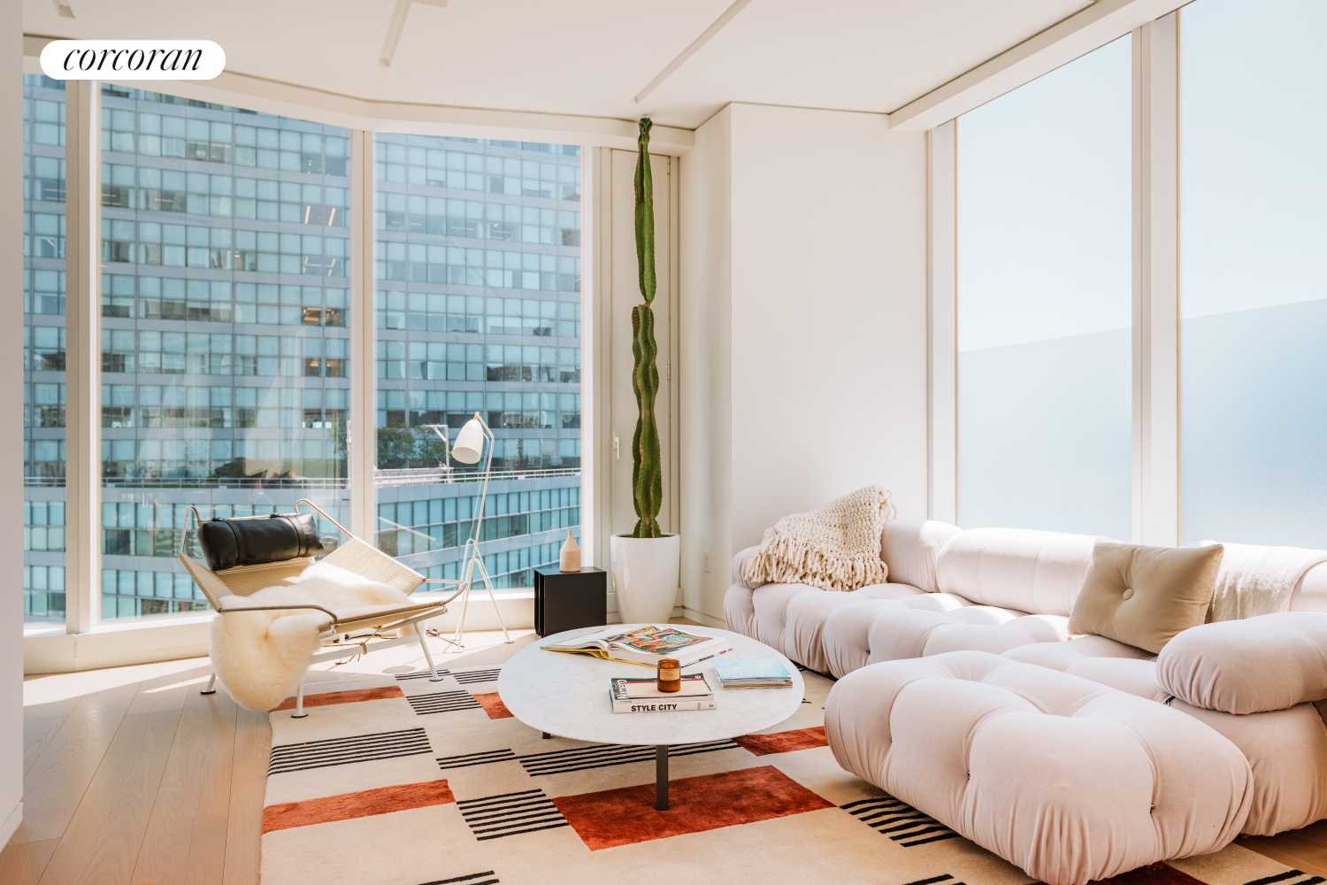 100 East 53rd Street, Unit 41B Manhattan, NY 10022 - Photo 2 of 25 a living room with furniture and a potted plant