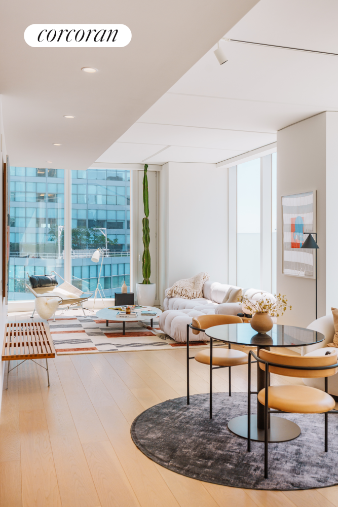 100 East 53rd Street, Unit 41B Manhattan, NY 10022 - Photo 5 of 25 a living room with furniture and a table