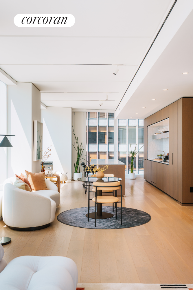 100 East 53rd Street, Unit 41B Manhattan, NY 10022 - Photo 6 of 25 a living room with furniture a large window and kitchen view