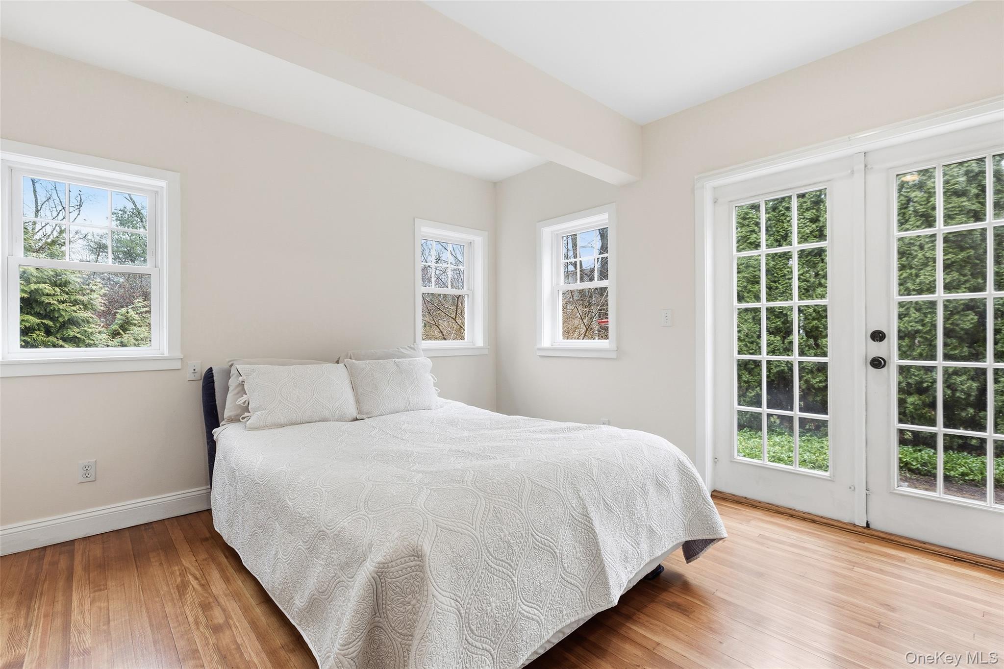 56 Huntville Road Katonah, NY 10536 - Photo 11 of 44 Large bedroom with french doors to stone patio.