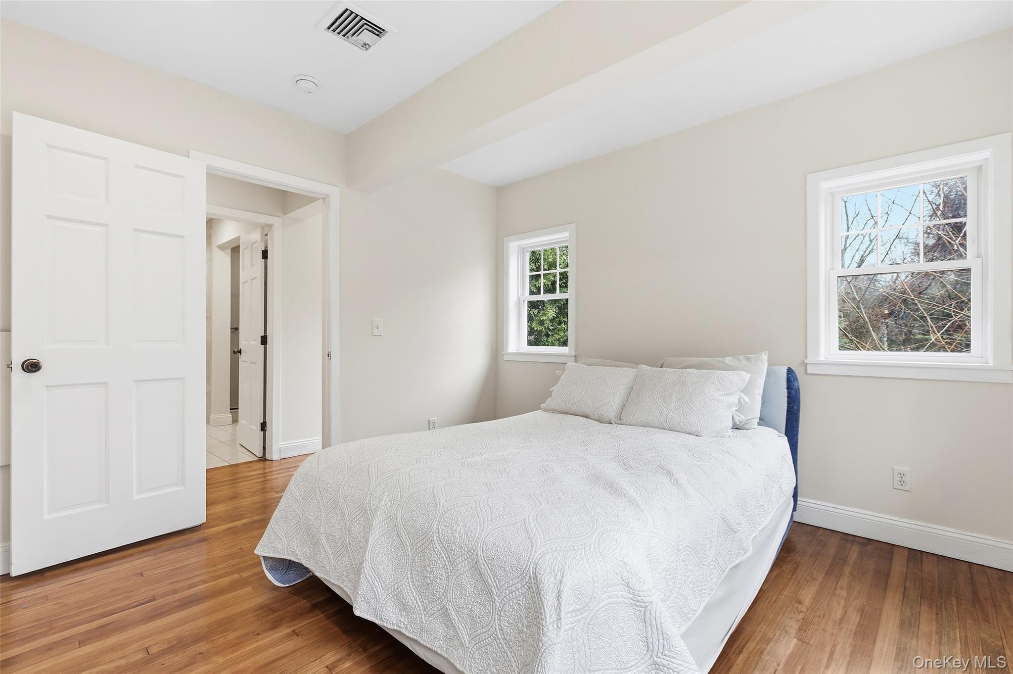 56 Huntville Road Katonah, NY 10536 - Photo 12 of 44 Large bedroom with french doors to stone patio.