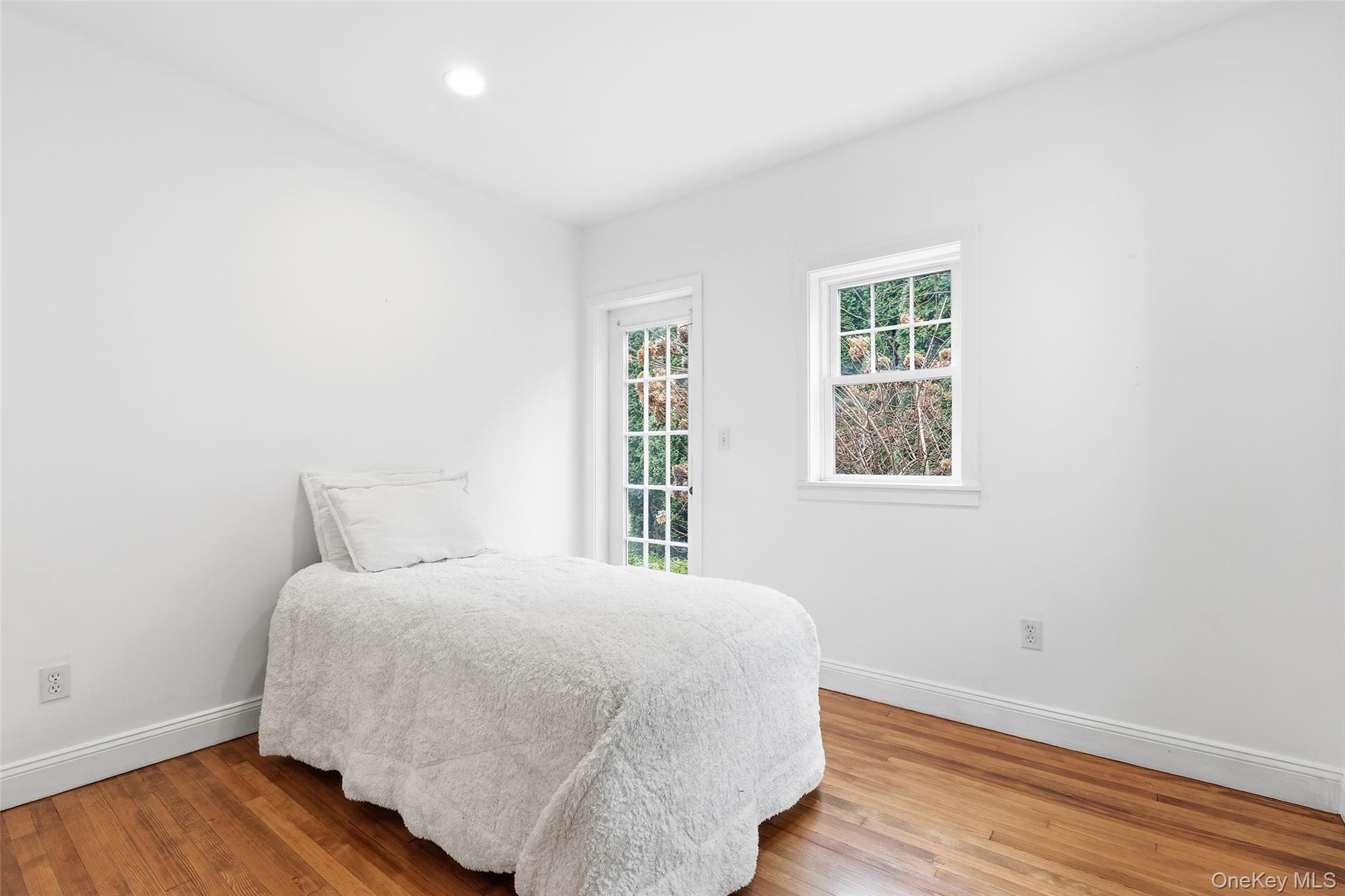 56 Huntville Road Katonah, NY 10536 - Photo 18 of 44 Bedroom with double closet and door to stone patio