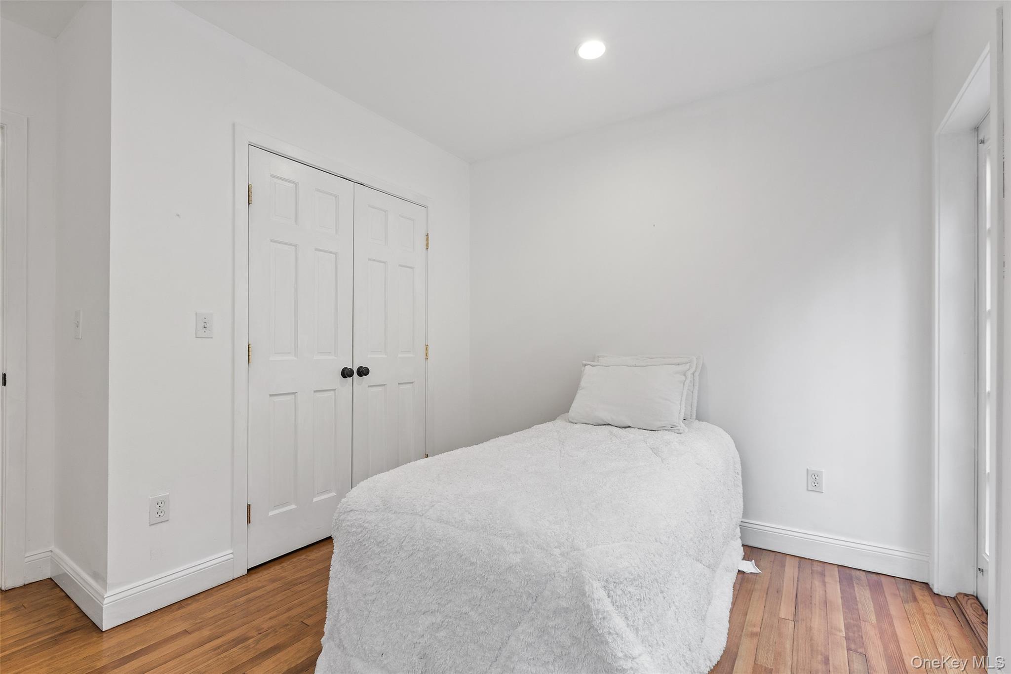 56 Huntville Road Katonah, NY 10536 - Photo 19 of 44 Bedroom with double closet and door to stone patio