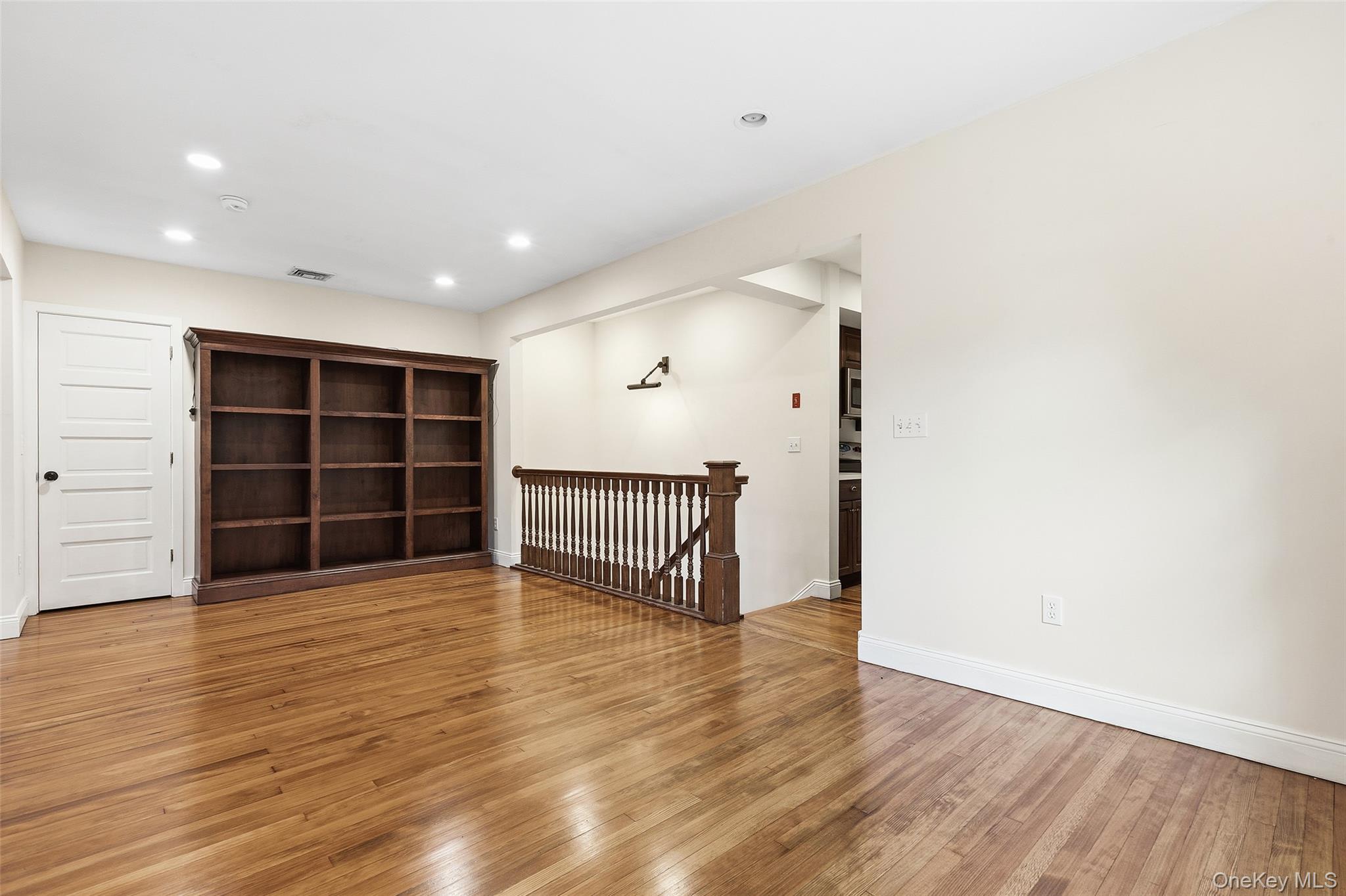 56 Huntville Road Katonah, NY 10536 - Photo 6 of 44 View from Dining area to Library/Sitting area and stairs to partially finished lower level.