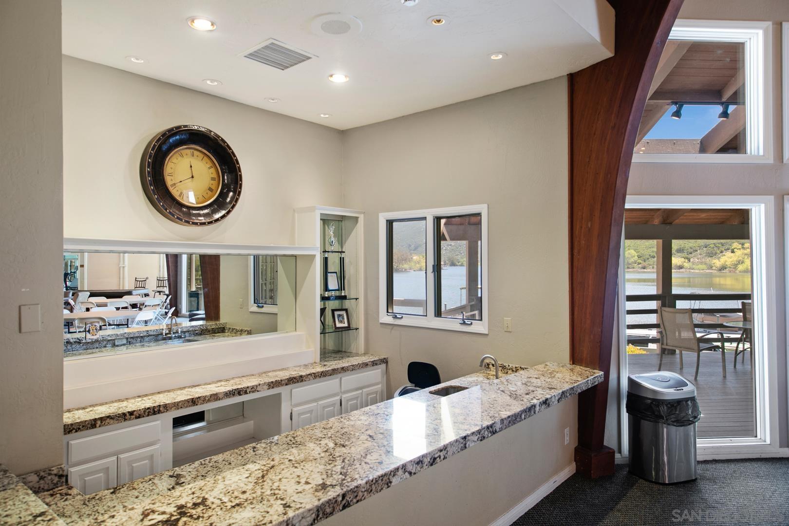 0 Via Viejas Oeste Alpine, CA 91901 - Photo 4 of 36 a living room with stainless steel appliances furniture a rug and a window