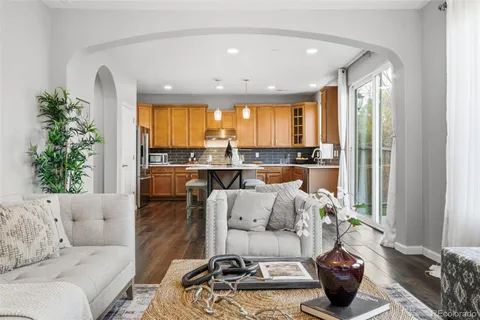 a living room with furniture and a table