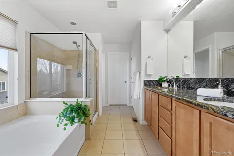 a dining room with furniture and a wooden floor