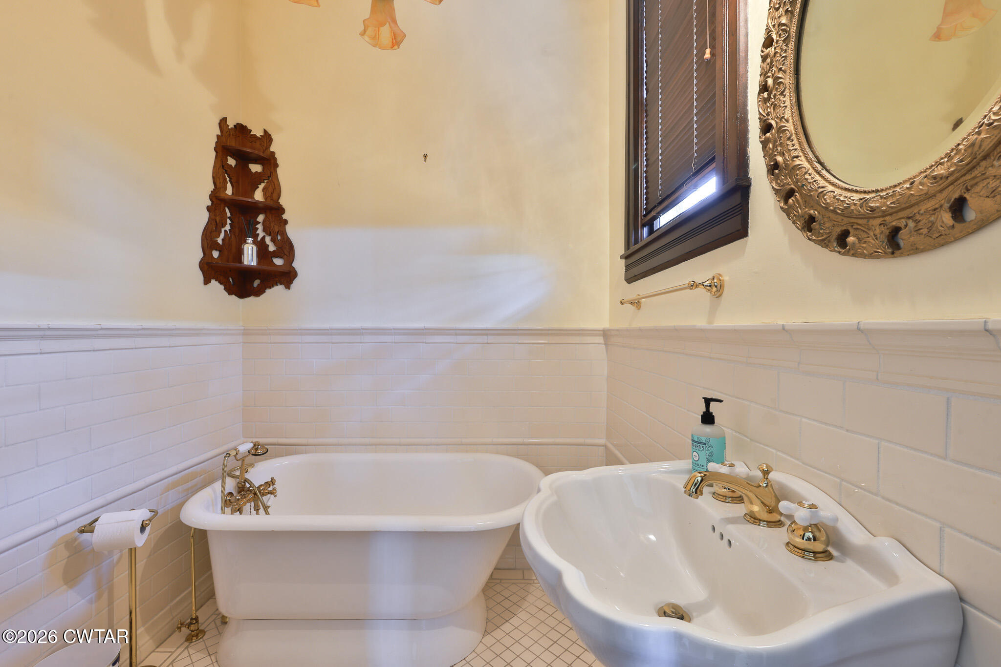 203 North McCombs Street Martin, TN 38237 - Photo 11 of 37 a bathroom with a sink and mirror
