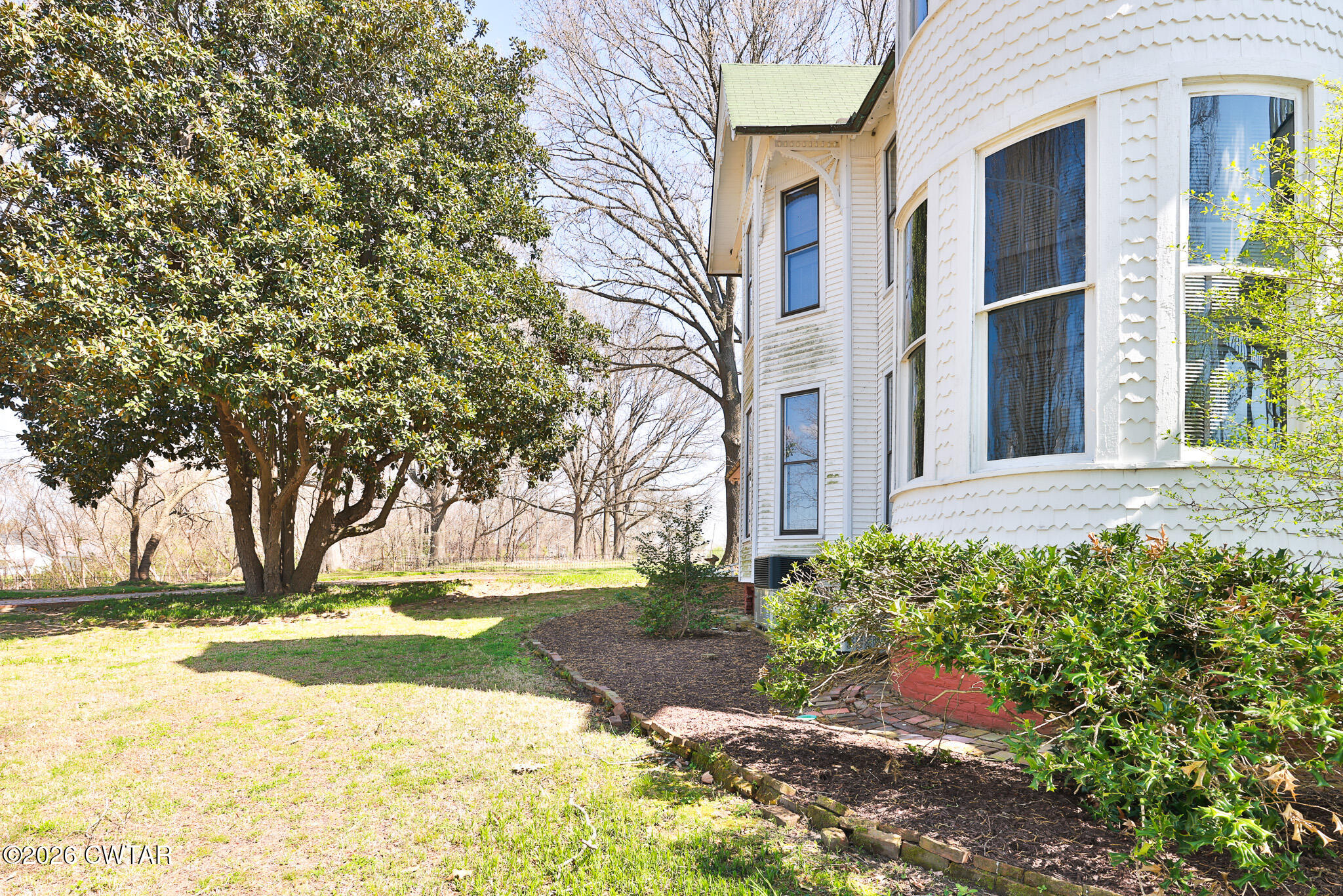 203 North McCombs Street Martin, TN 38237 - Photo 30 of 37 a view of a house with a yard and potted plants