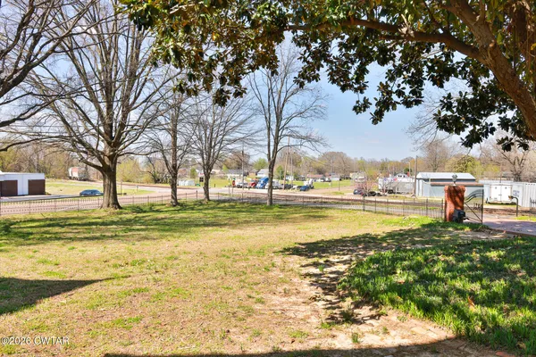 a view of a backyard of the house