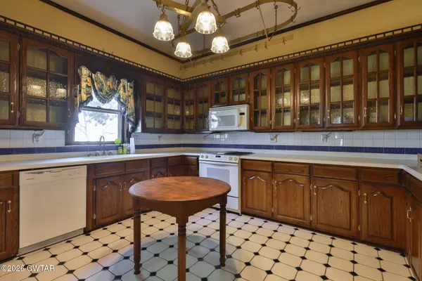 a kitchen with stainless steel appliances a sink and cabinets