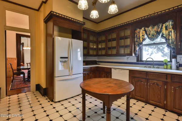 a kitchen with stainless steel appliances a refrigerator and a stove