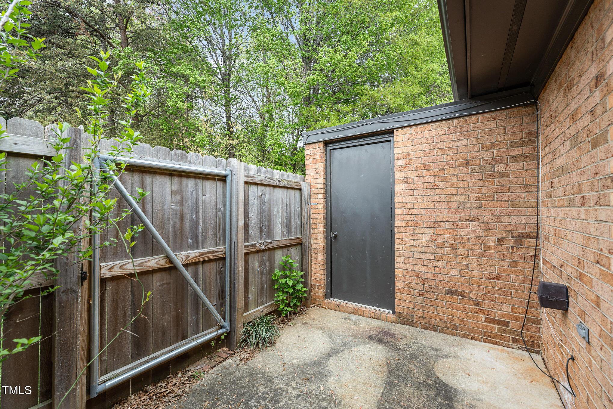 4828 Tower Road, Unit D Greensboro, NC 27410 - Photo 23 of 29 Private Patio with Storage Closet