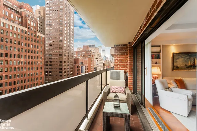 a view of balcony with furniture