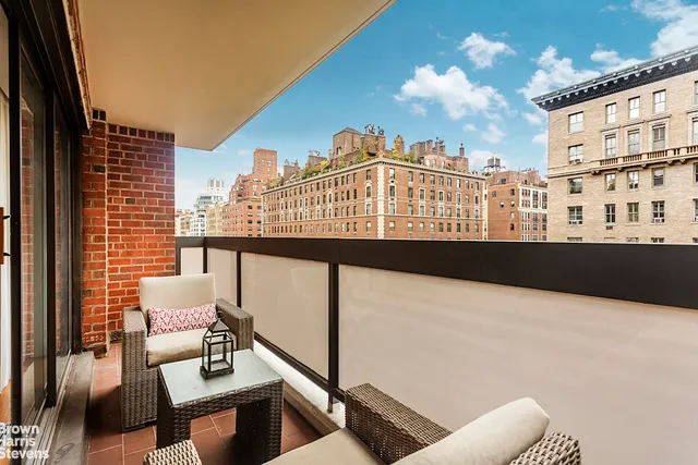 a view of a balcony with furniture