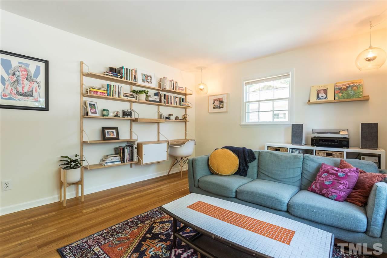 812 Cooper Road Raleigh, NC 27610 - Photo 4 of 29 Built in shelves add functionality to the living room