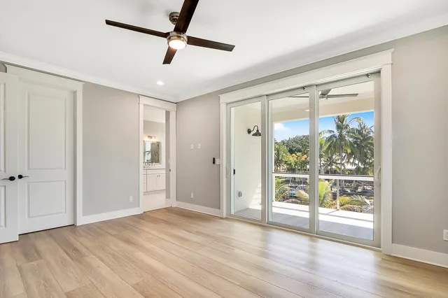 a bathroom with a tub a sink double vanity and a mirror