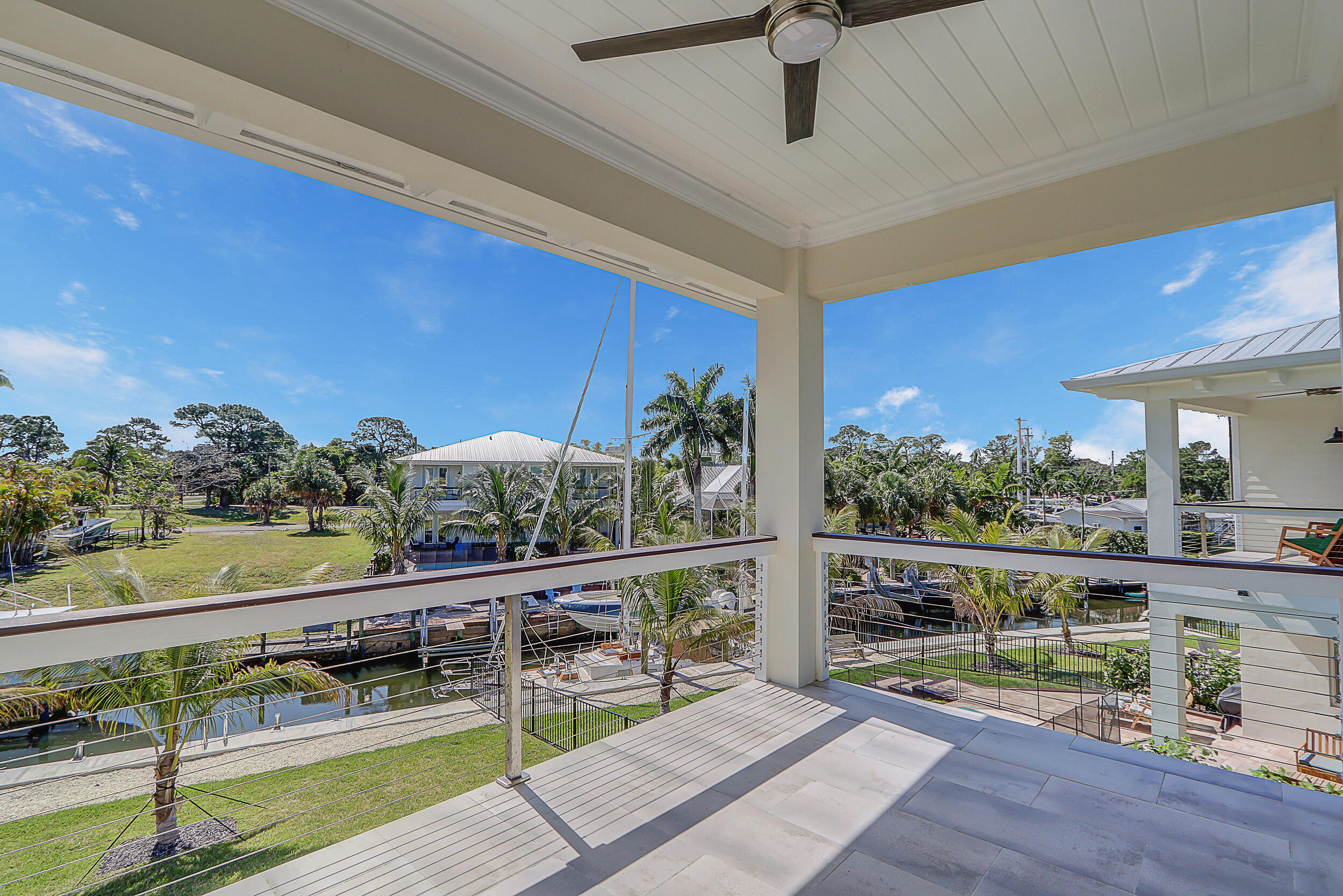 4629 Southeast Manatee Lane Stuart, FL 34997 - Photo 14 of 31 a view of swimming pool with seating space and wooden floor
