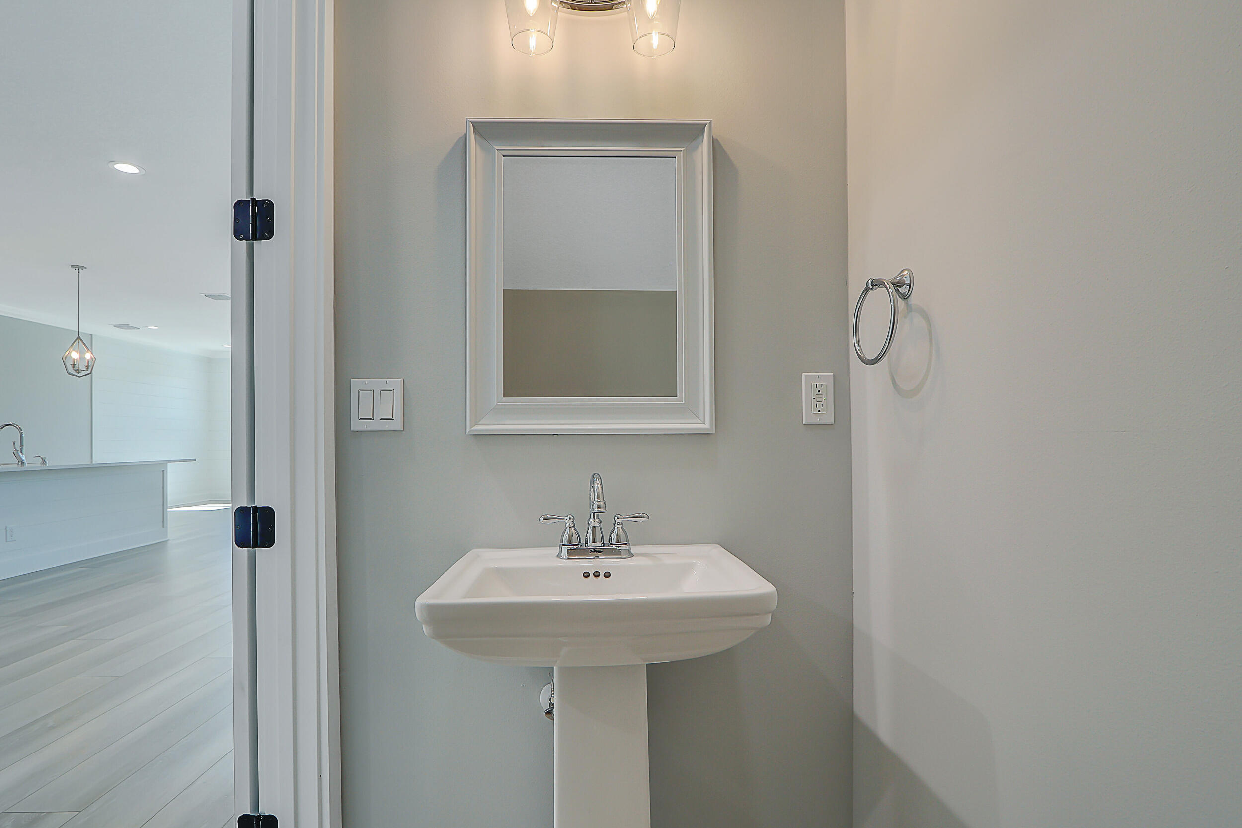 4629 Southeast Manatee Lane Stuart, FL 34997 - Photo 20 of 31 a bathroom with a sink a mirror and shower