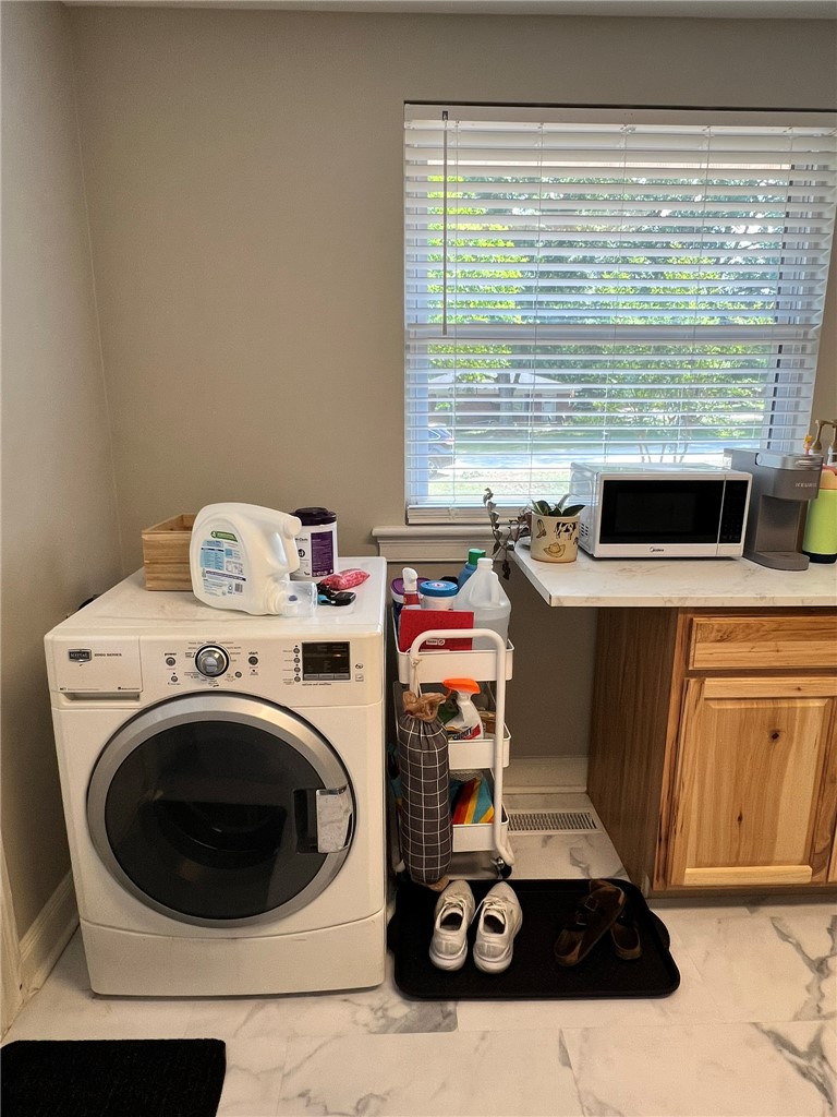 101 Clinton Drive, Unit B Anderson, SC 29621 - Photo 15 of 18 This functional laundry room combines practicality with modern style.