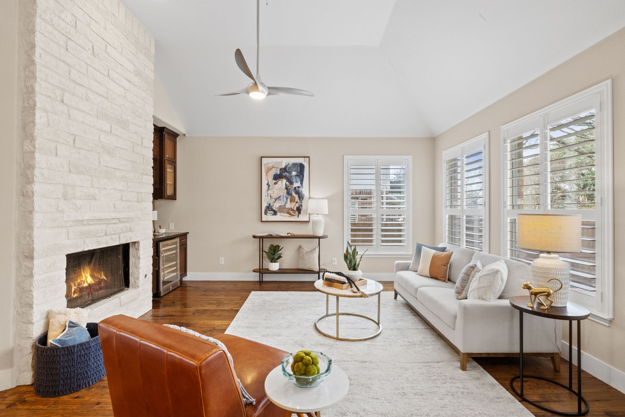 8112 Cobblestone Austin, TX 78735 - Photo 8 of 33 Living room featuring vaulted ceiling, dark wood-style floors, plenty of natural light, a fireplace, and ceiling fan