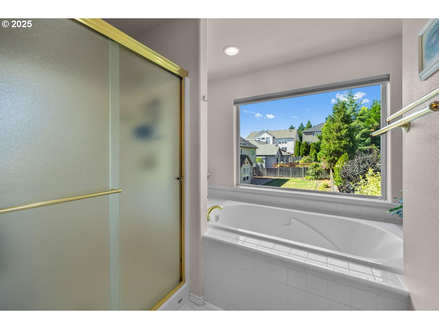 14941 Northwest Wendy Lane Portland, OR 97229 - Photo 15 of 26 a bathroom with a bathtub and a shower