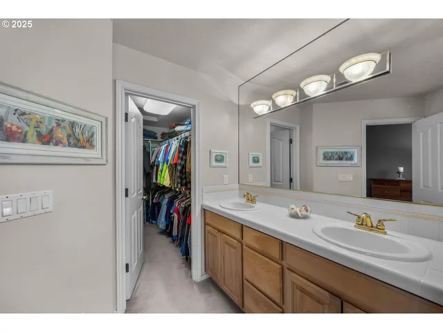 a bathroom with a sink vanity and a mirror