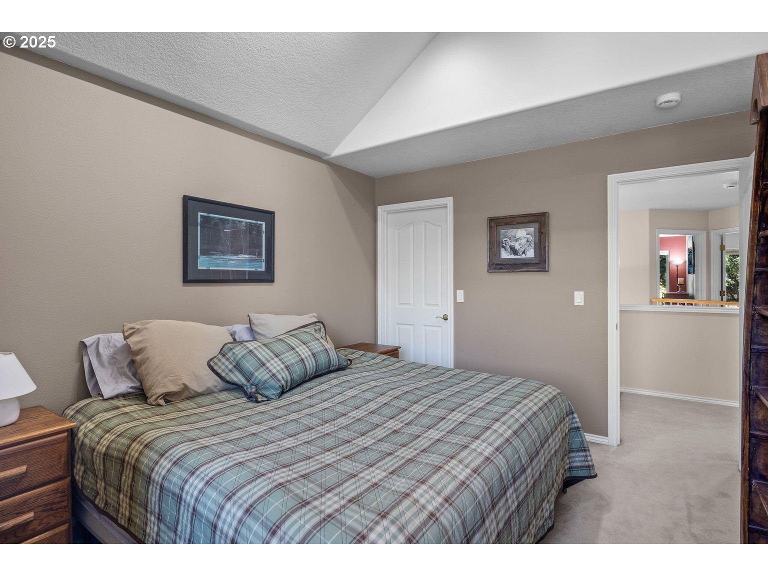 14941 Northwest Wendy Lane Portland, OR 97229 - Photo 18 of 26 a bedroom with a bed and a painting on the wall