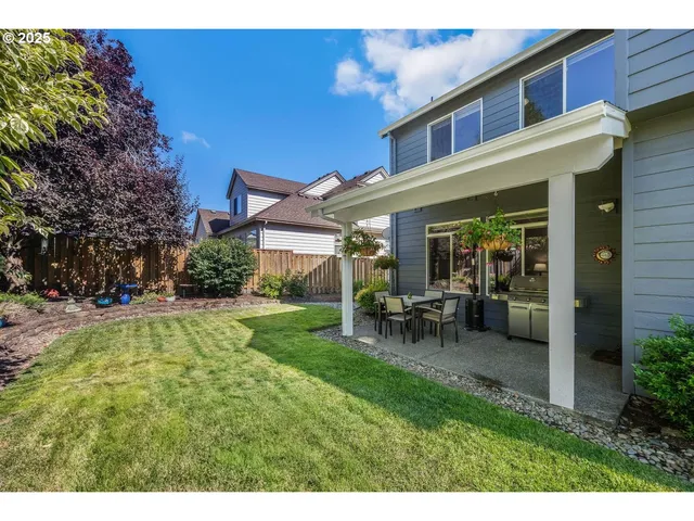 a view of an house with backyard porch and sitting area