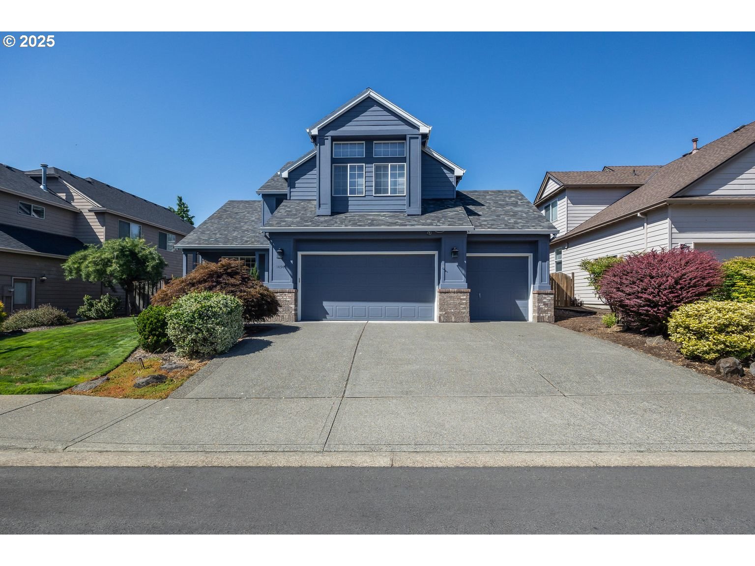 14941 Northwest Wendy Lane Portland, OR 97229 - Photo 3 of 26 a front view of a house with a yard and garage