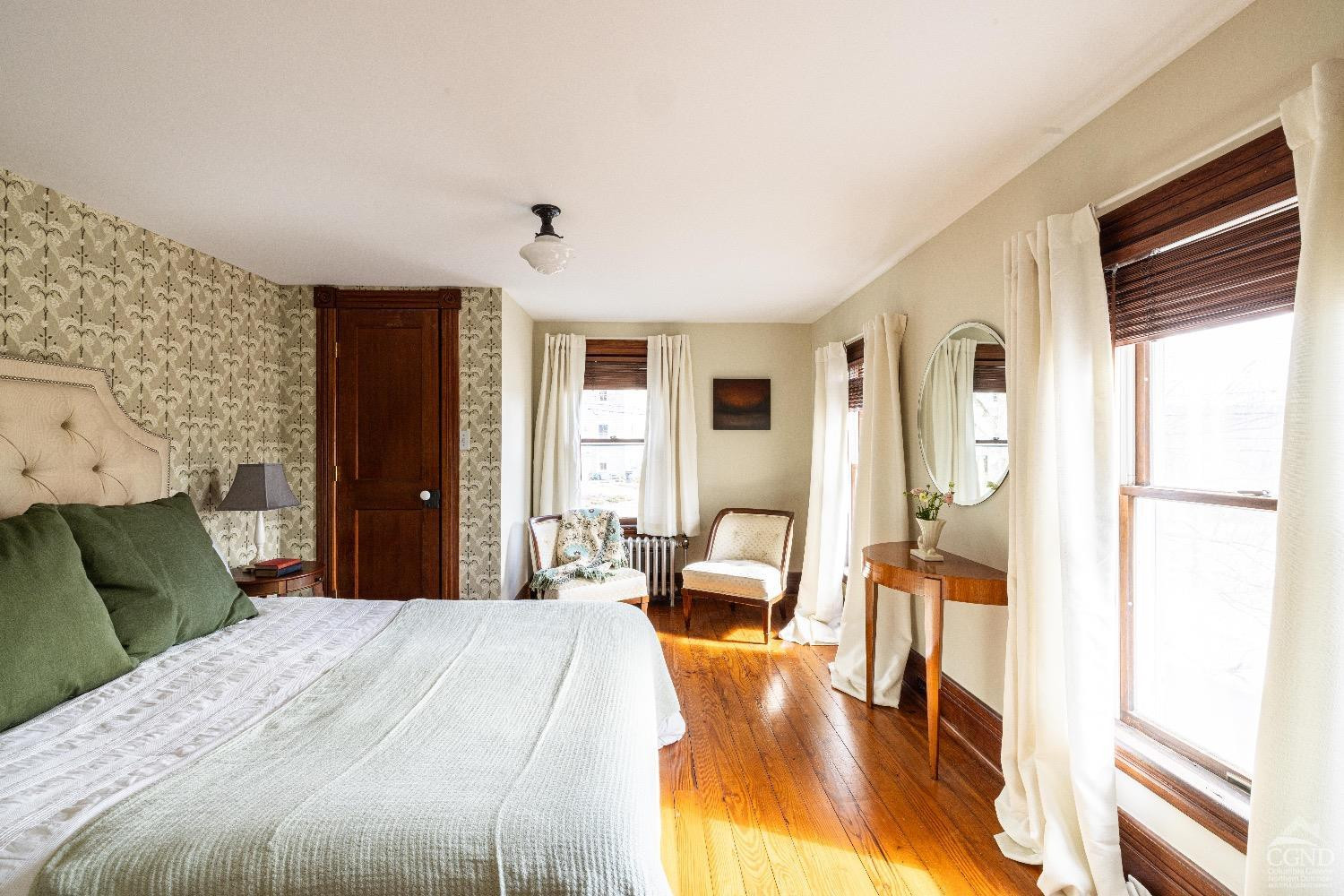 1301 Co Rte 7 Ancram, NY 12502 - Photo 21 of 52 a bedroom with a bed and wooden floor