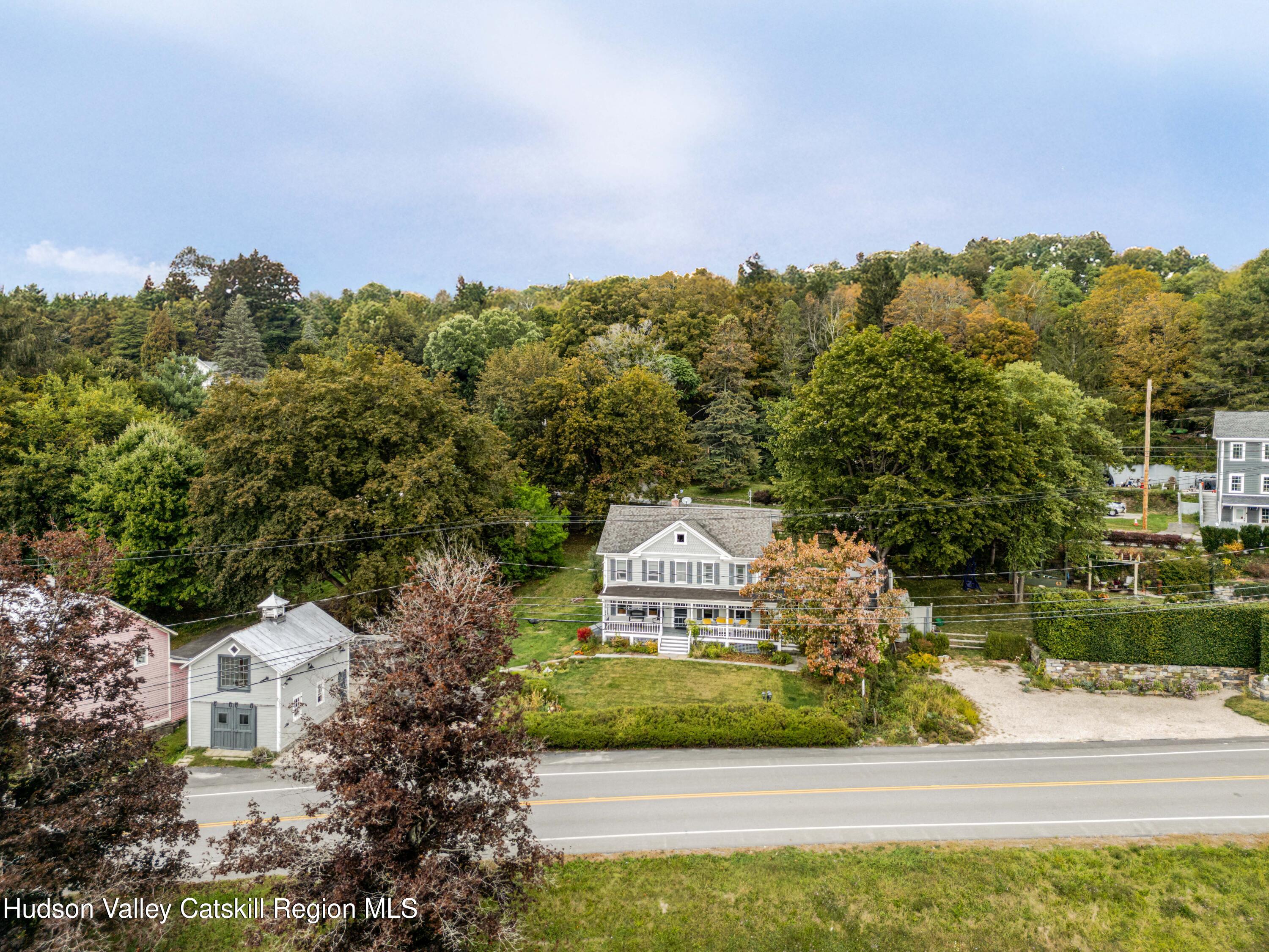 1301 Co Rte 7 Ancram, NY 12502 - Photo 4 of 52 a view of a house with a yard and potted plants