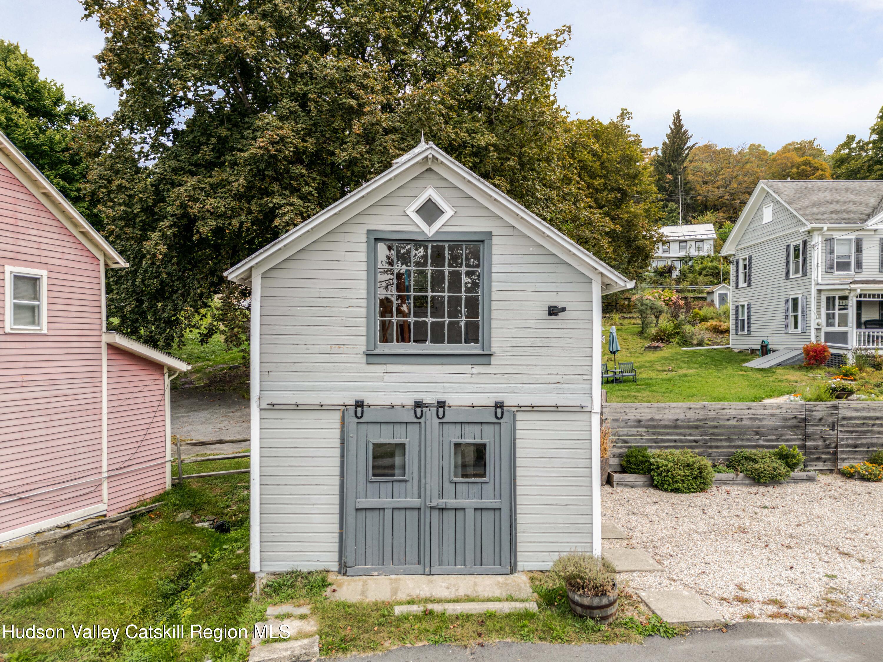 1301 Co Rte 7 Ancram, NY 12502 - Photo 46 of 52 a front view of a house with a yard