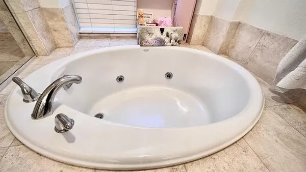 a white bath tub sitting in a bathroom