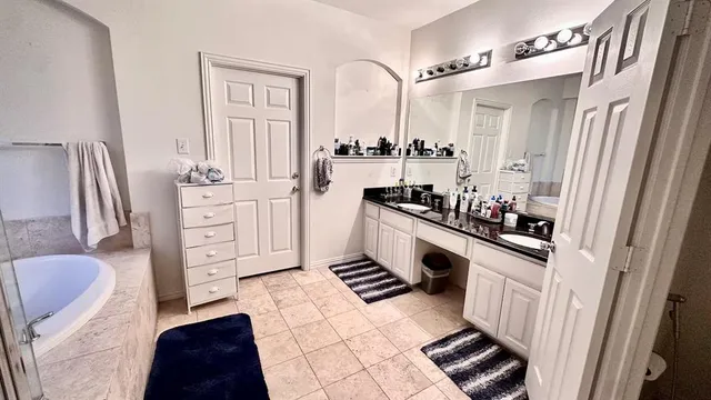 a kitchen with stainless steel appliances granite countertop sink stove top oven and cabinets