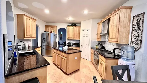 a view of a dining room with furniture and a rug