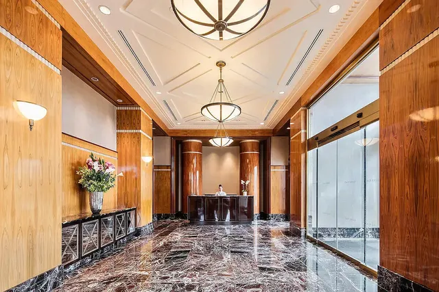 a dining room with furniture and wooden floor