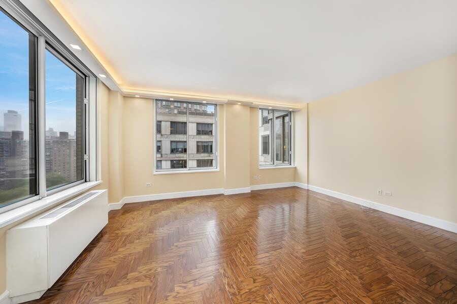 200 Riverside Boulevard, Unit 15E Manhattan, NY 10069 - Photo 4 of 15 a view of an empty room with a window