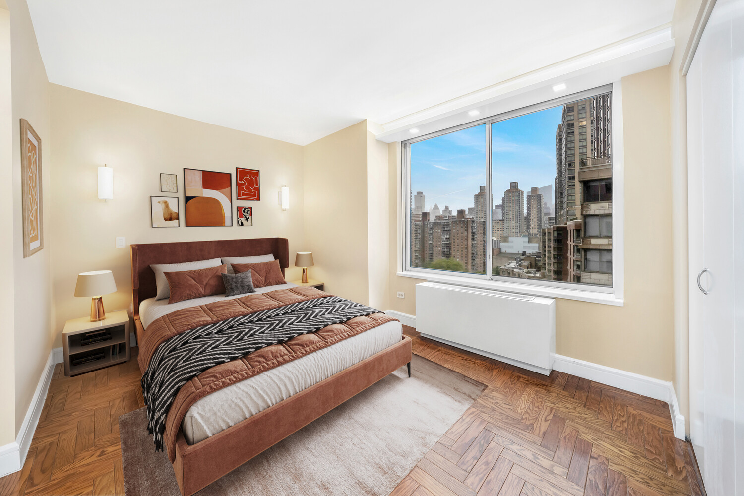 200 Riverside Boulevard, Unit 15E Manhattan, NY 10069 - Photo 7 of 15 a bedroom with a large bed and a window