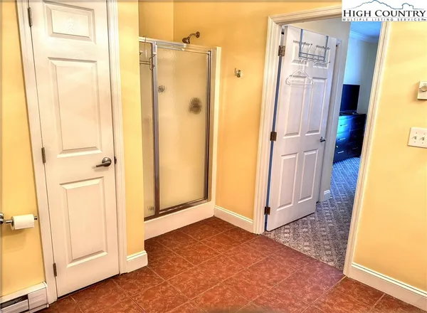a view of a bathroom with wooden floor