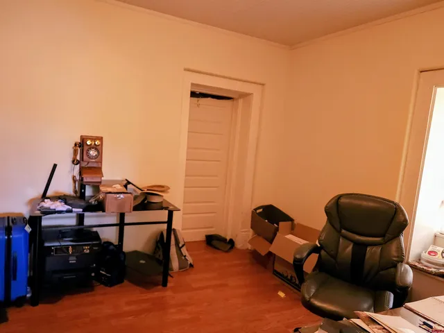 a room with furniture and gym equipment